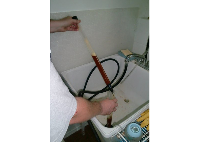 Filling up test tube to check for specific gravity